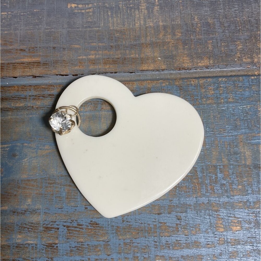 White Heart-Shaped Plastic Pendant With Clear Gemstone Charm